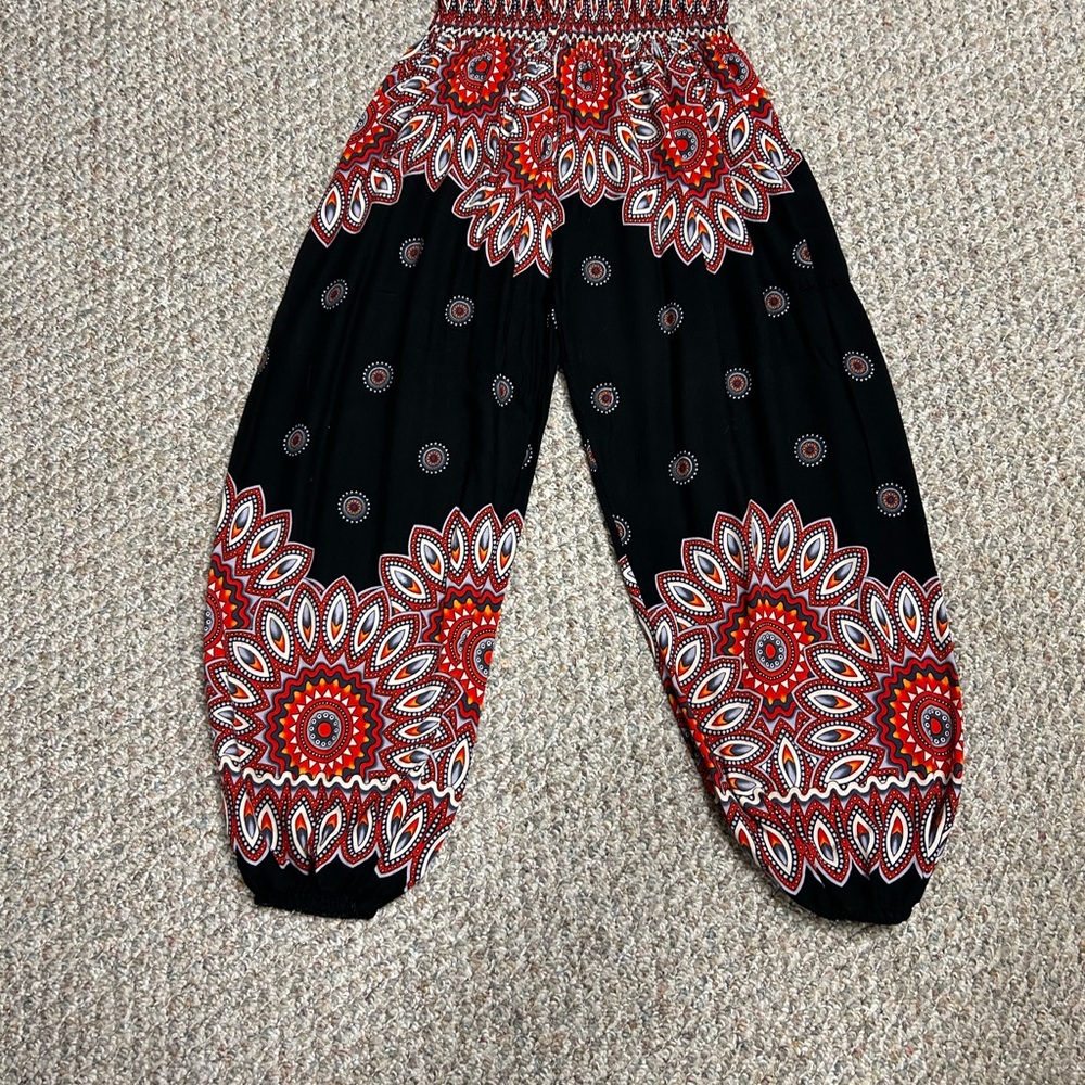 Very comfy boho Harem pants. Vibrant reds oranges mandala pattern against black